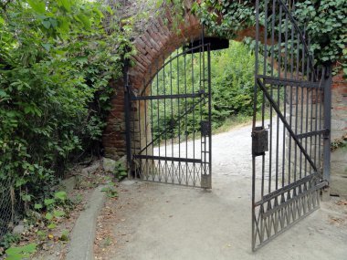 https://depositphotos.com/photo/classical-design-black-wrought-iron-gate-in-a-beautiful-green-garden-11919447.html